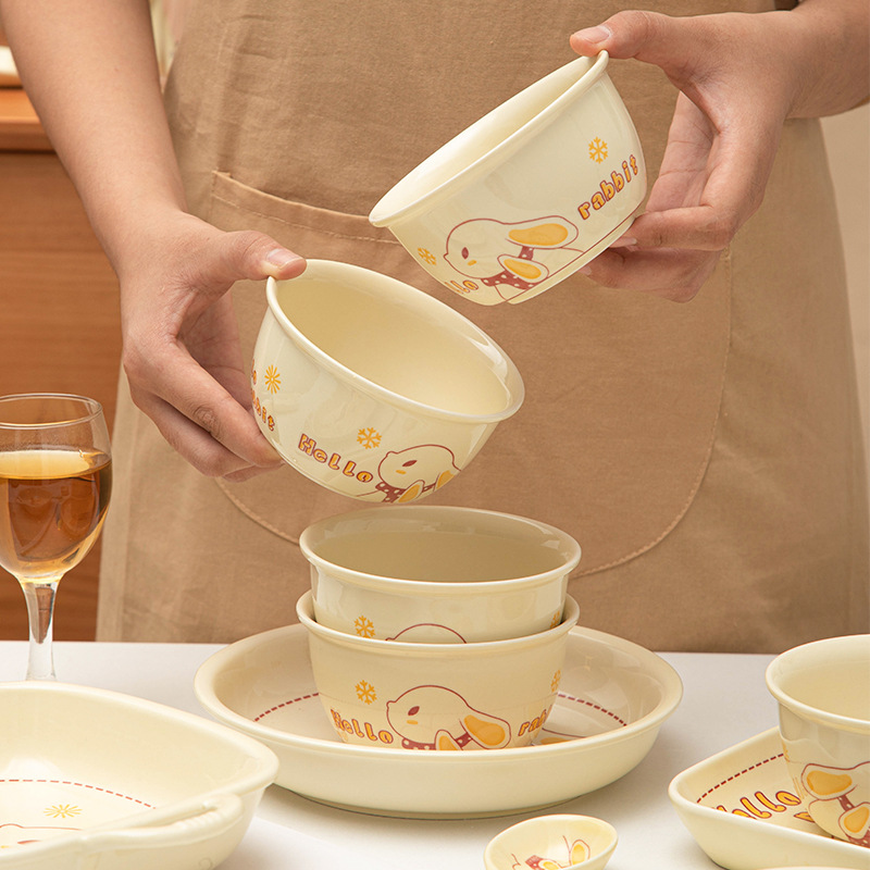 Cream style ceramic dish and cutlery set